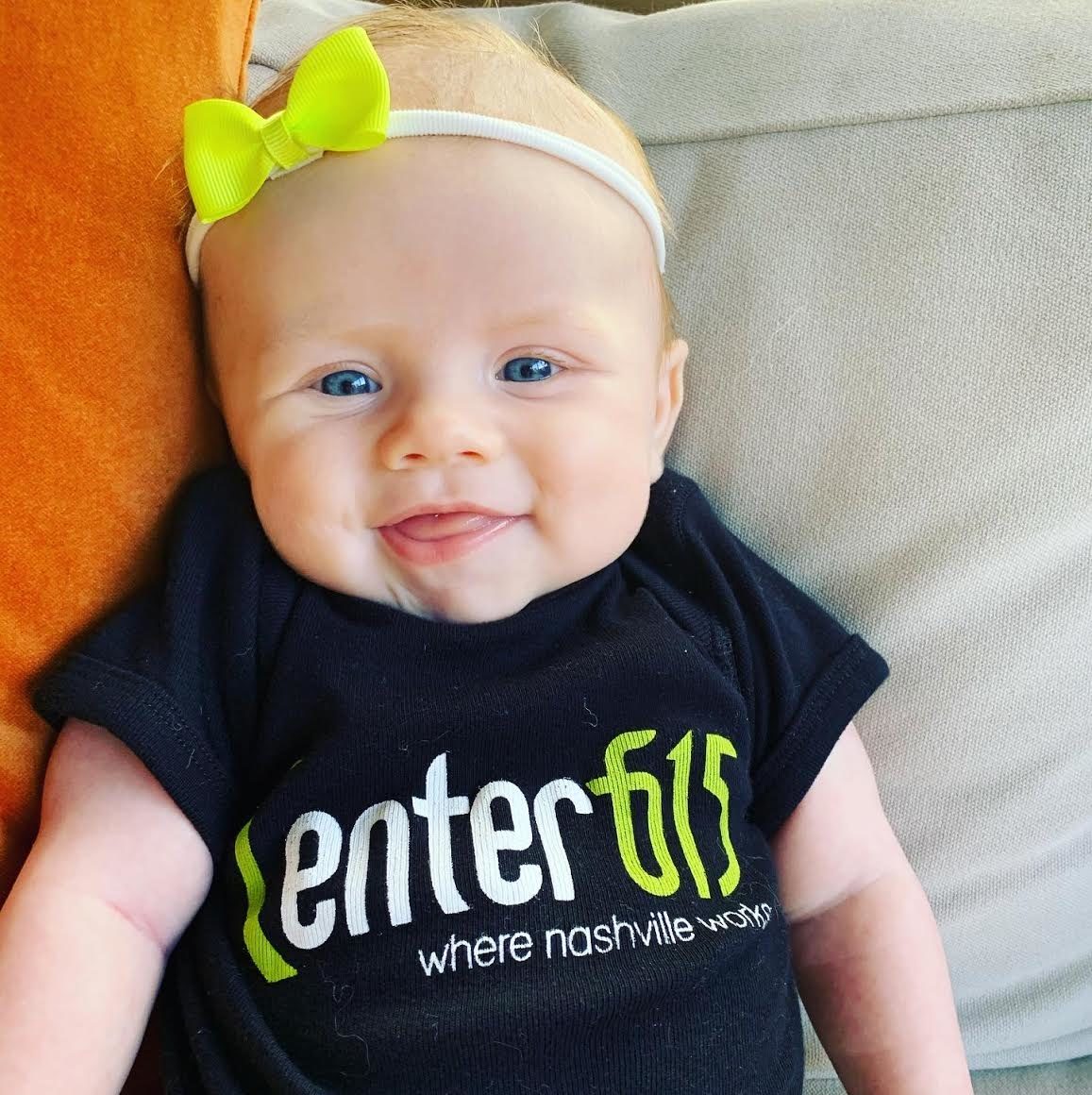 Baby wearing a Center 615 shirt.