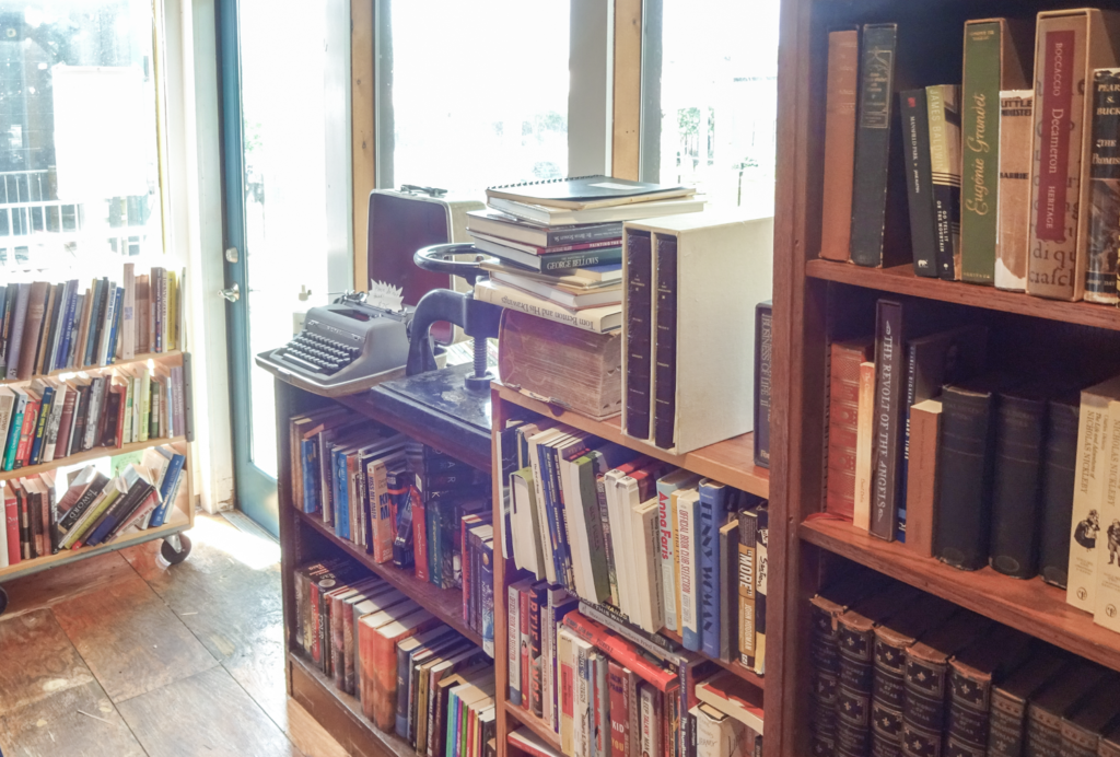 Inside Defunct Bookstore in East Nashville. Pile of books and typewriter