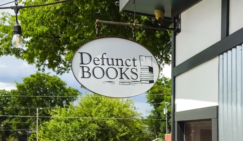 Defunct Books sign at the Five Points Alley Shops in East Nashville